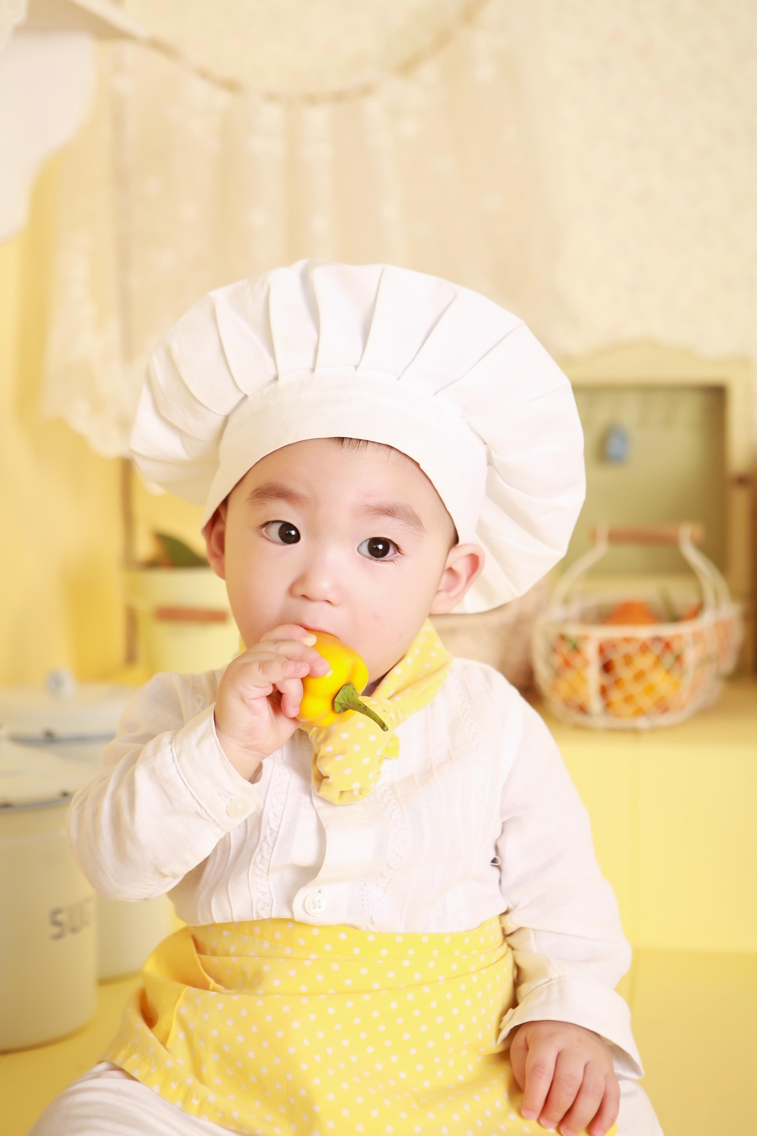 A happy chef with a bread in hands